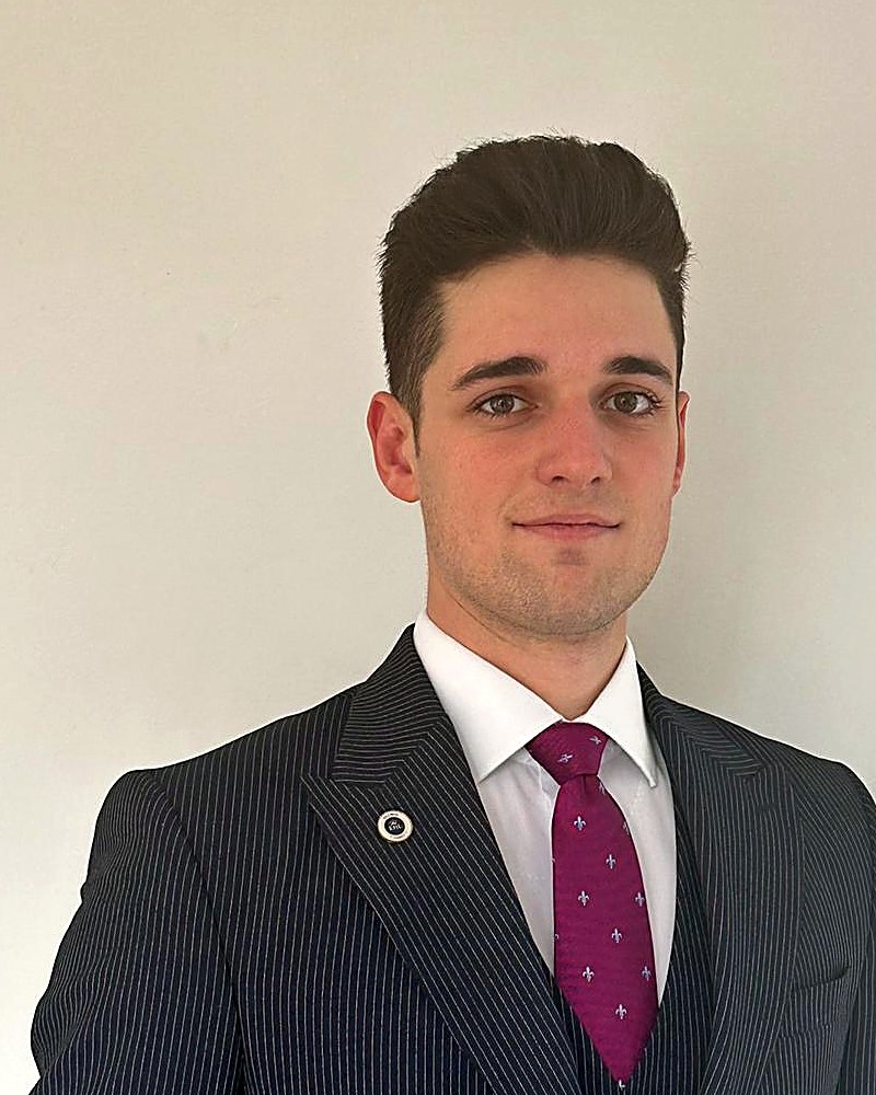 Fabian Reptsis, based in Zurich, in a tailored pinstripe suit